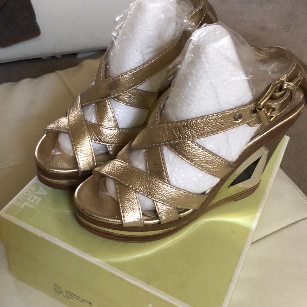 Micheal Kors gold wedges